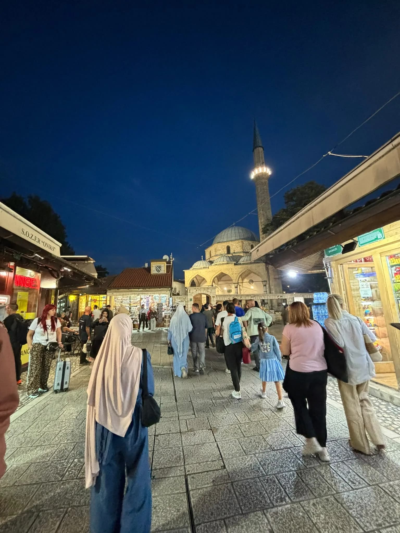 Baščaršija in the evening, with the Gazi Husrev-beg Mosque lit up