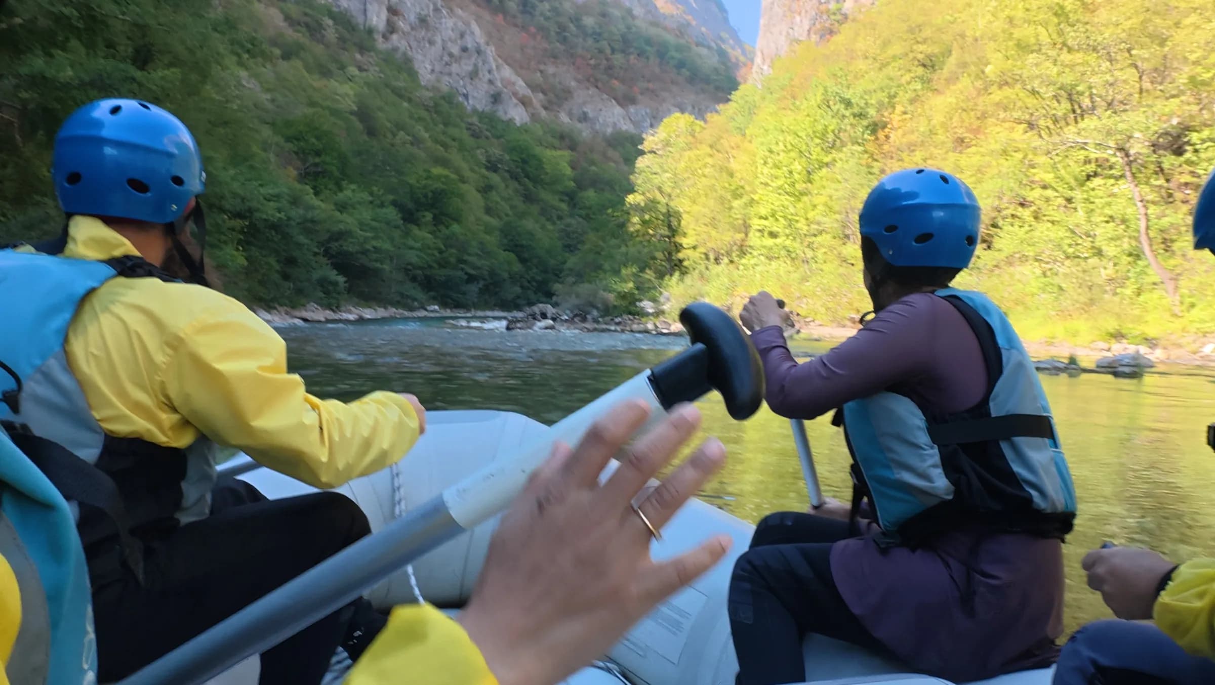 Rafting down the river through a green canyon