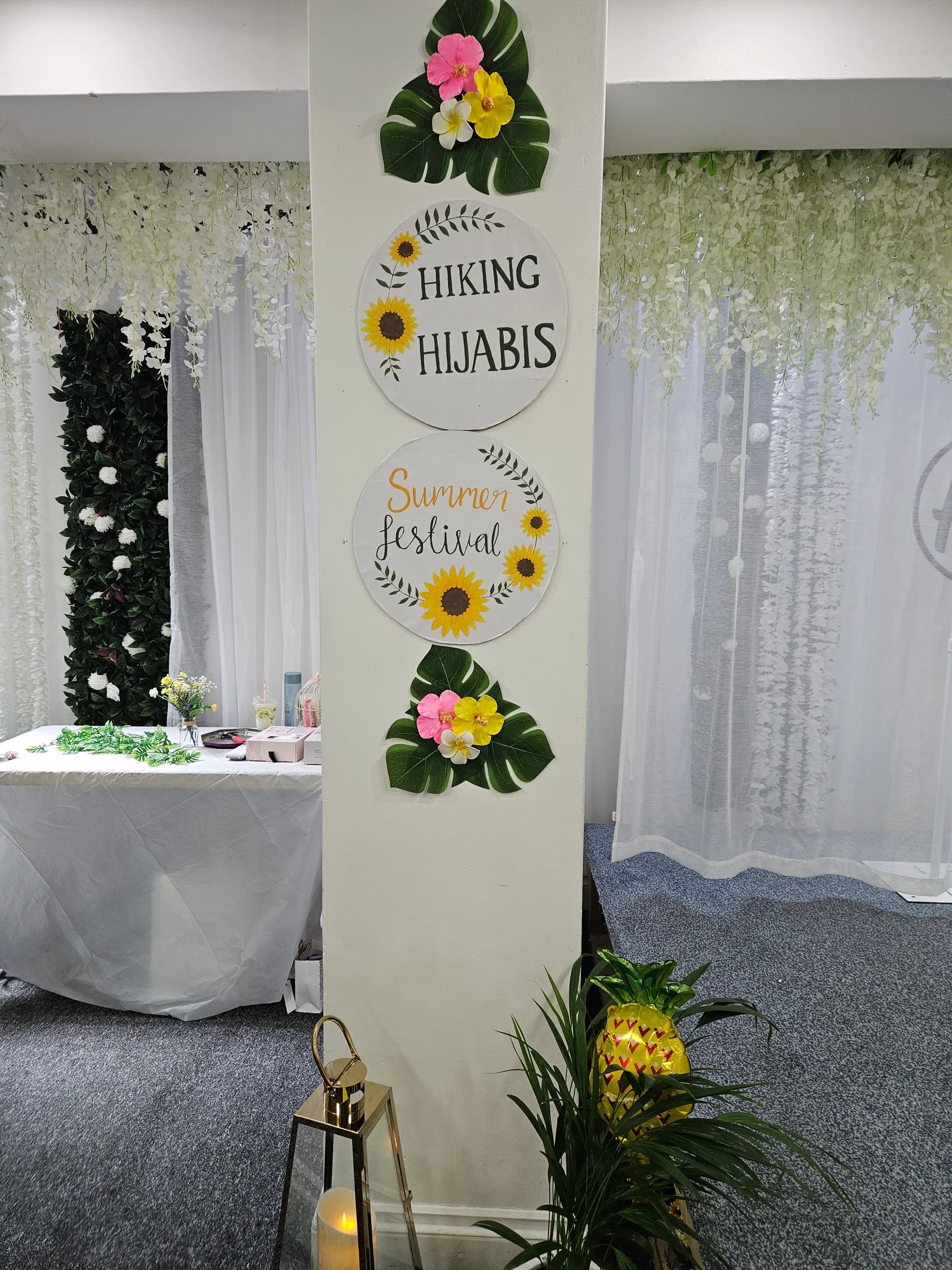 Hiking Hijabis Summer Festival signs and flowers