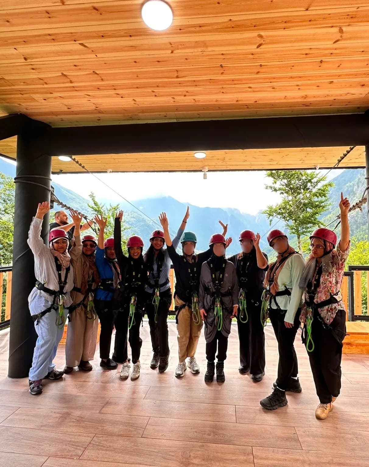 The group in harnesses and helmets, ready for the zipline
