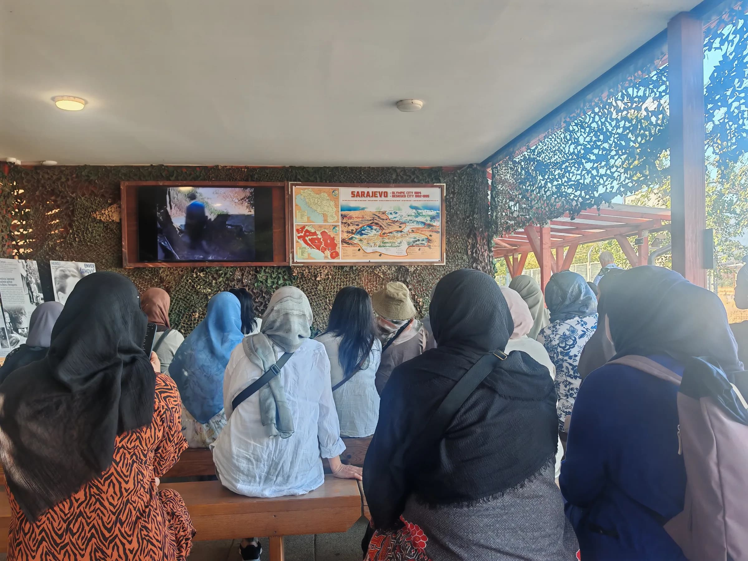The group listening to a talk at a museum