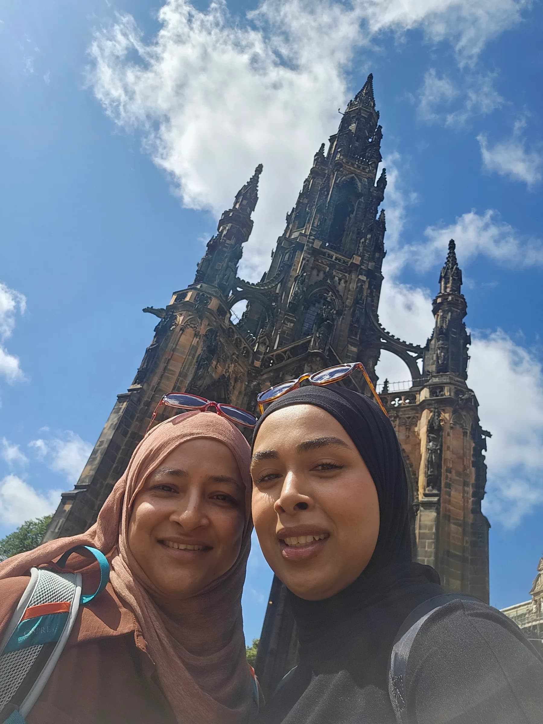 Two sisters taking a selfie by the Scott Monument in Edinburgh
