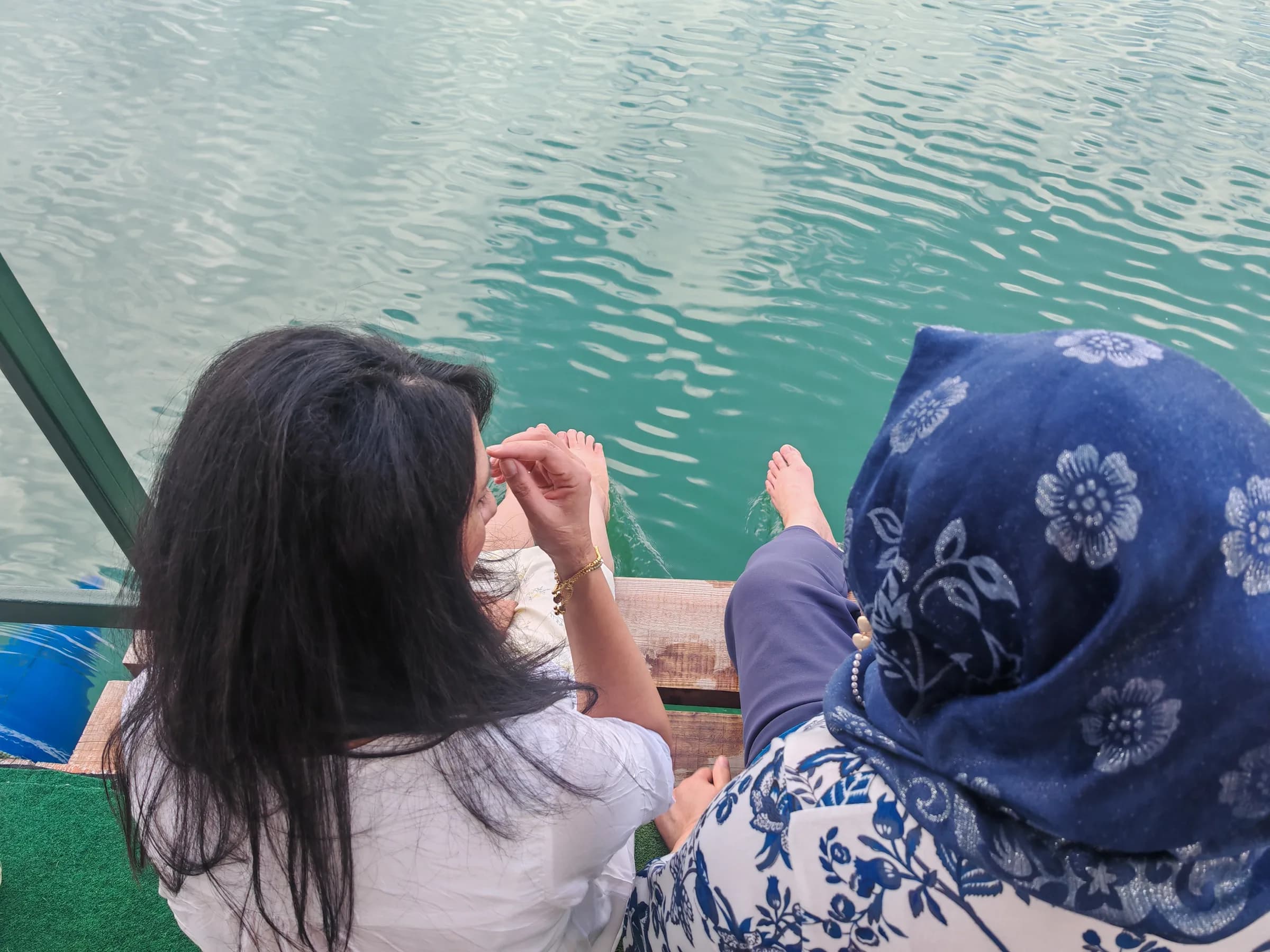 Two sisters looking out over the water at Jablanica Lake