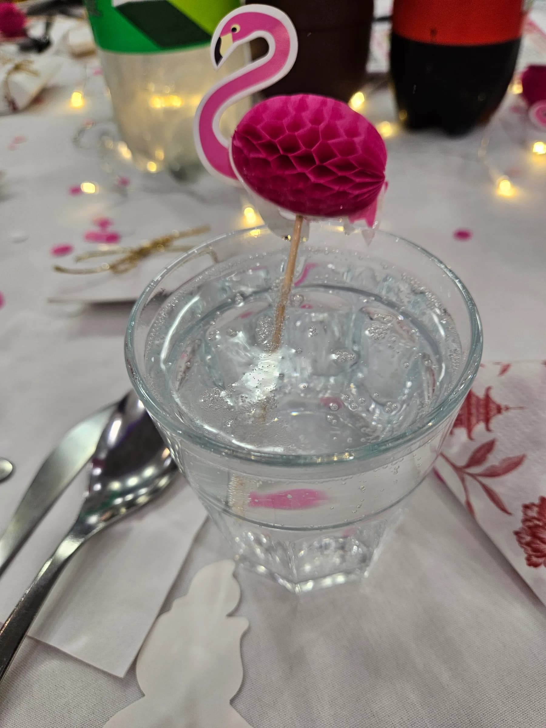 A drink with a paper flower decoration